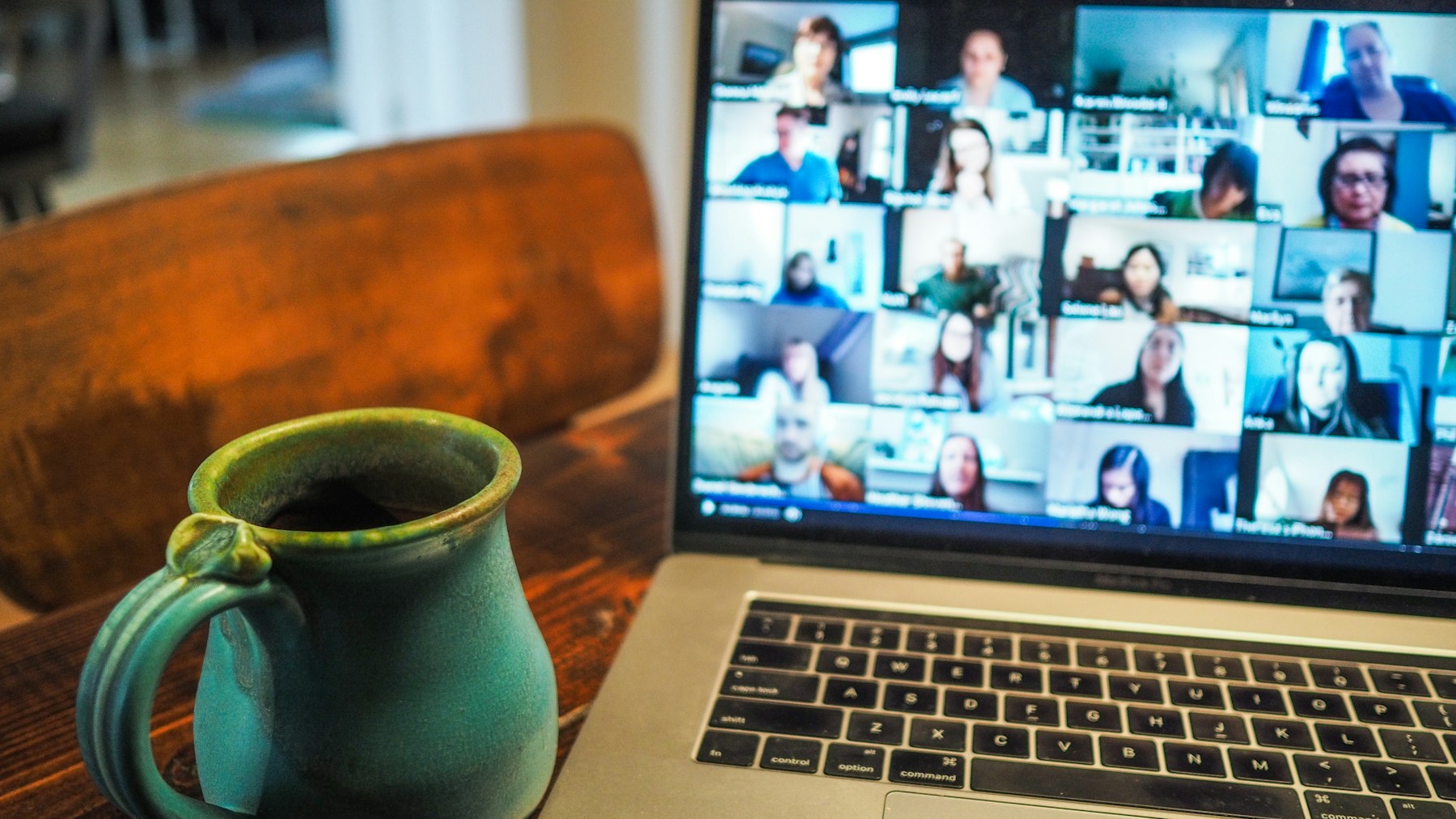 Laptop screen showing a remote video meeting