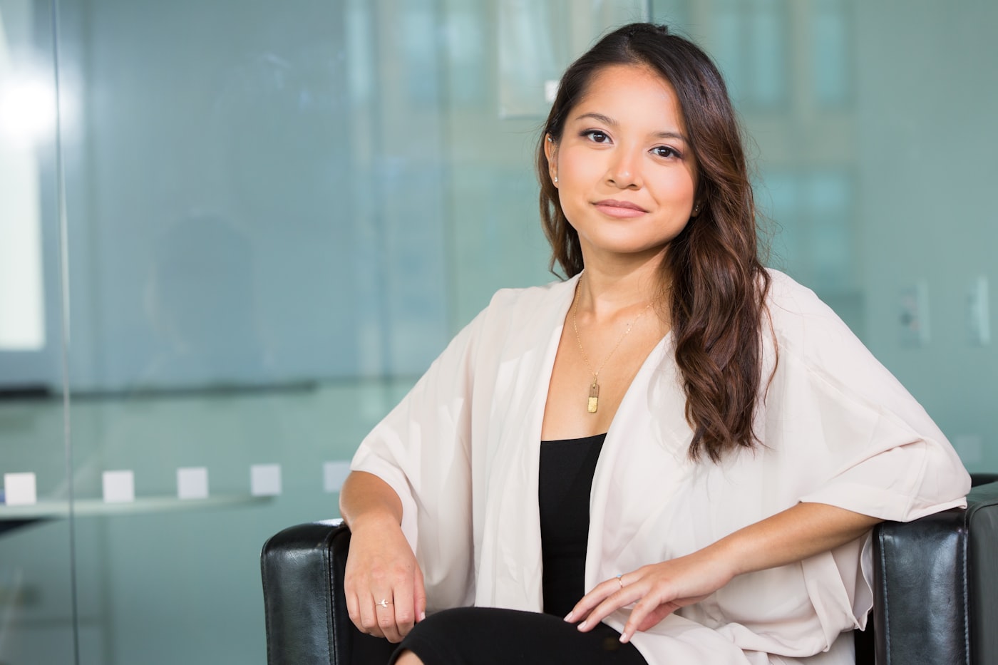 A professional sitting thoughtfully in a modern office, reflecting on change at work.
